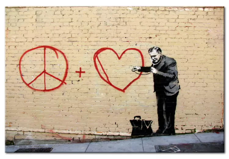 Lekarz pacyfista (Banksy) - street art mężczyzny na ceglanej ścianie