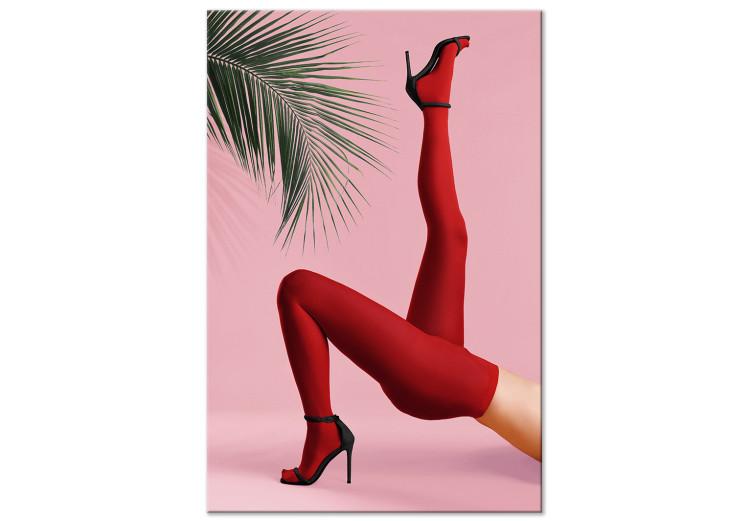 Obraz na płótnie Czerwone rajstopy - liść palmy, kobiecie nogi i szpilki na różowym tle