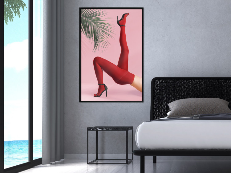 Plakat Czerwone rajstopy - kobiecie nogi, szpilki i liść palmy na różowym tle 144125 additionalImage 21