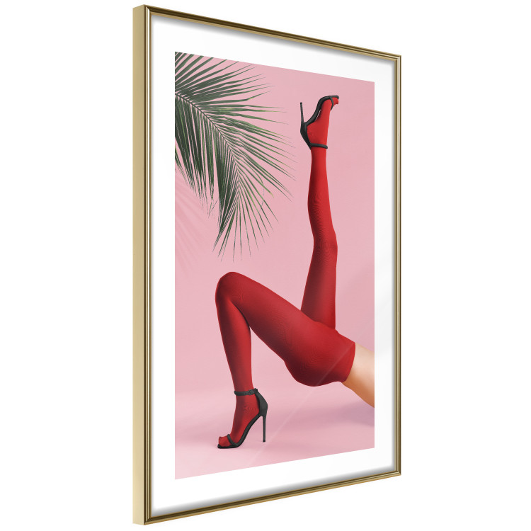 Plakat Czerwone rajstopy - kobiecie nogi, szpilki i liść palmy na różowym tle 144125 additionalImage 10