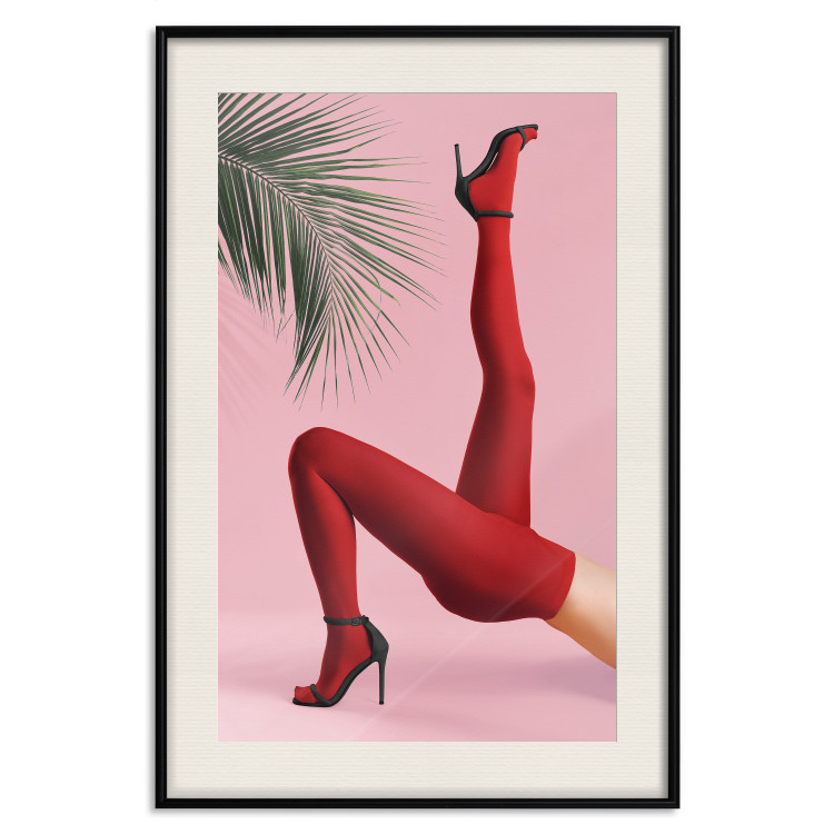 Plakat Czerwone rajstopy - kobiecie nogi, szpilki i liść palmy na różowym tle 144125 additionalImage 26