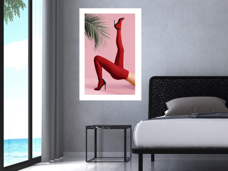 Plakat Czerwone rajstopy - kobiecie nogi, szpilki i liść palmy na różowym tle 144125 additionalImage 13