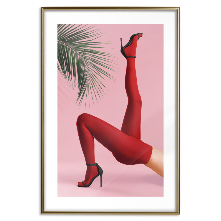Plakat Czerwone rajstopy - kobiecie nogi, szpilki i liść palmy na różowym tle 144125 additionalImage 25