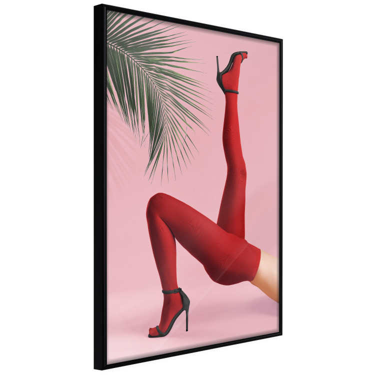 Plakat Czerwone rajstopy - kobiecie nogi, szpilki i liść palmy na różowym tle 144125 additionalImage 2