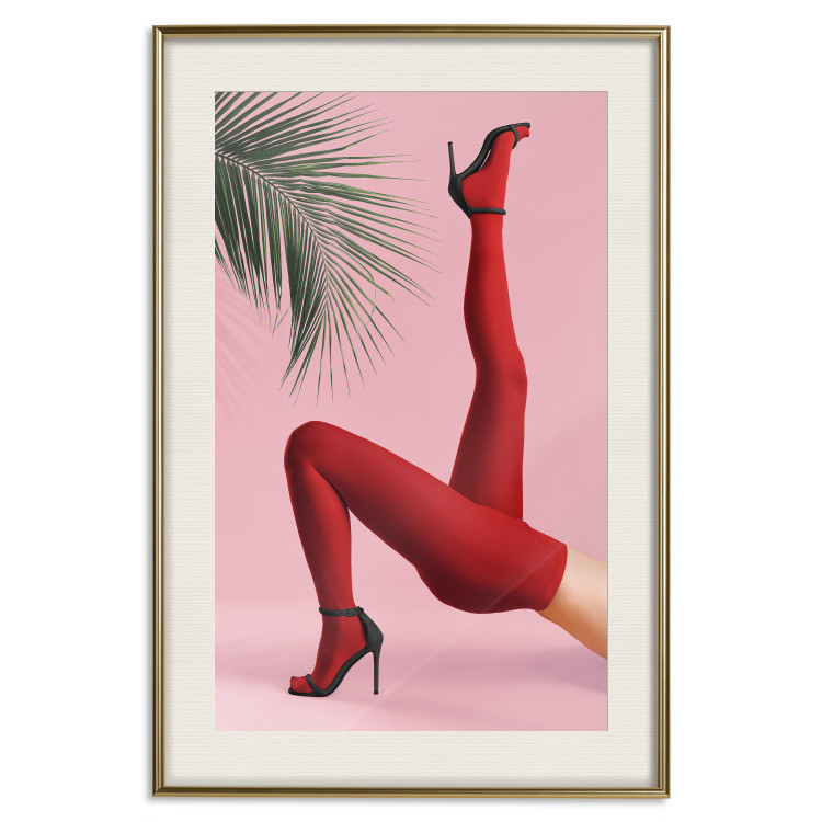 Plakat Czerwone rajstopy - kobiecie nogi, szpilki i liść palmy na różowym tle 144125 additionalImage 23