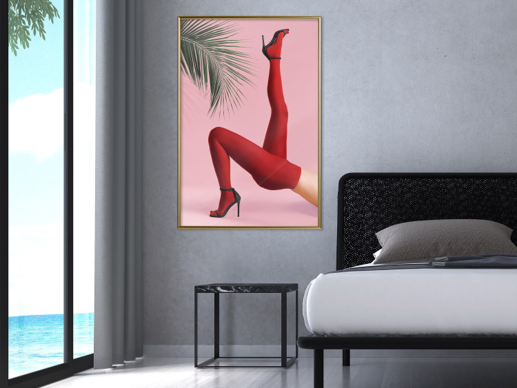 Plakat Czerwone rajstopy - kobiecie nogi, szpilki i liść palmy na różowym tle 144125 additionalImage 12