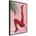 Plakat Czerwone rajstopy - kobiecie nogi, szpilki i liść palmy na różowym tle 144125 additionalThumb 2